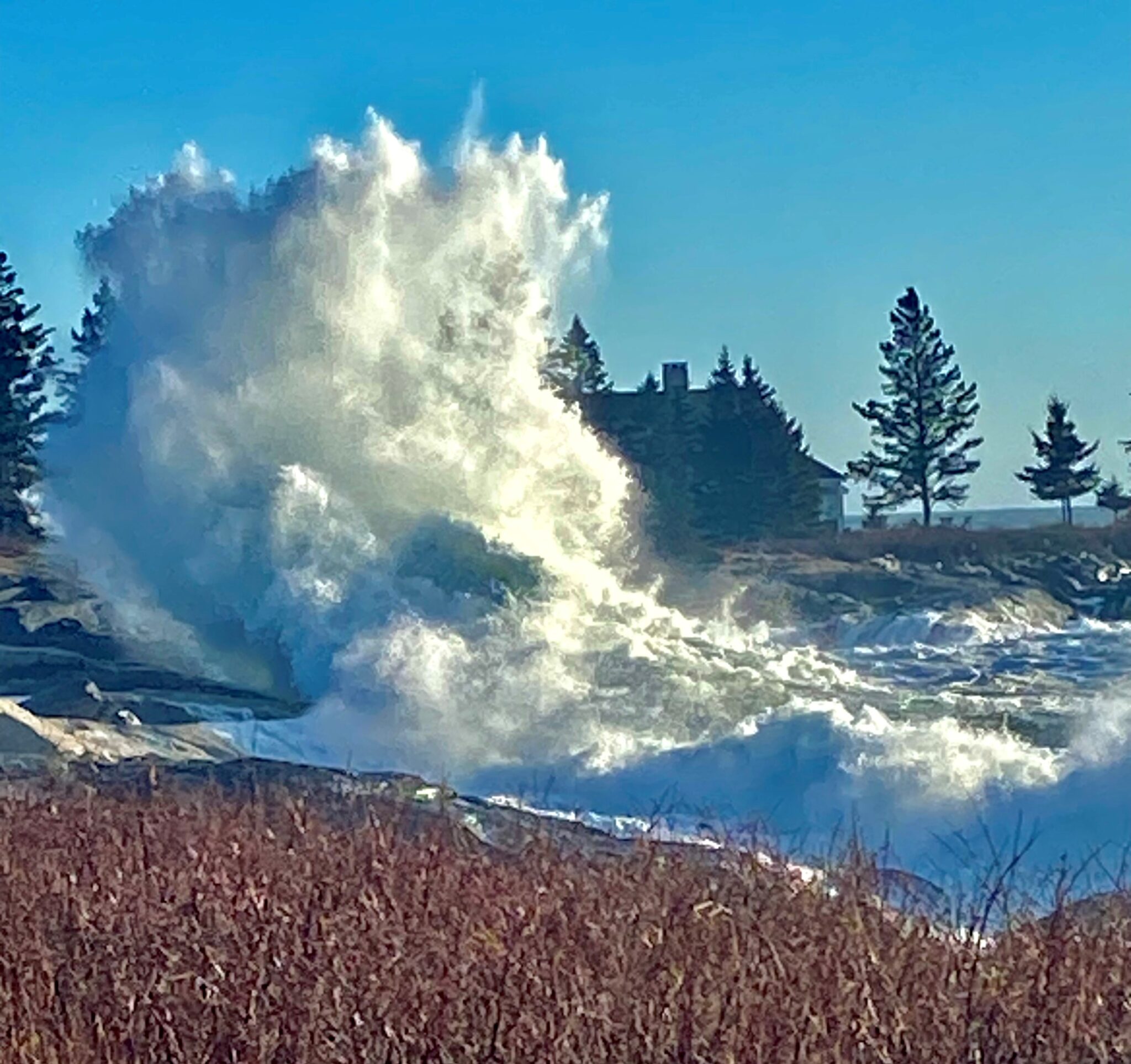 Amazing wave with spray reaching unbelievable heights.
