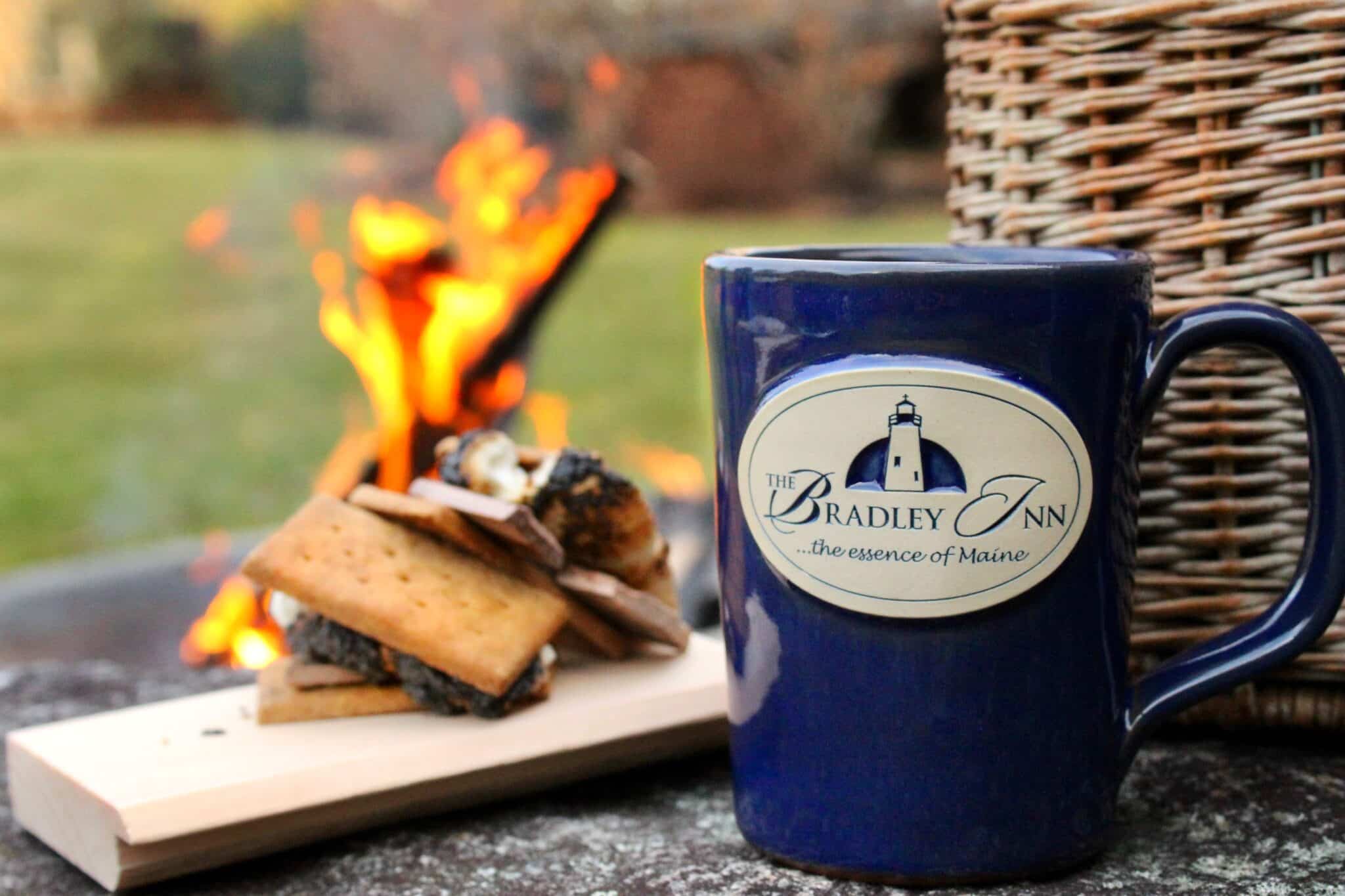 Close up of a navy blue, Bradley Inn mug, with smores on an