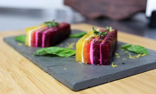 Beautiful multi colored beet terrine on a slate